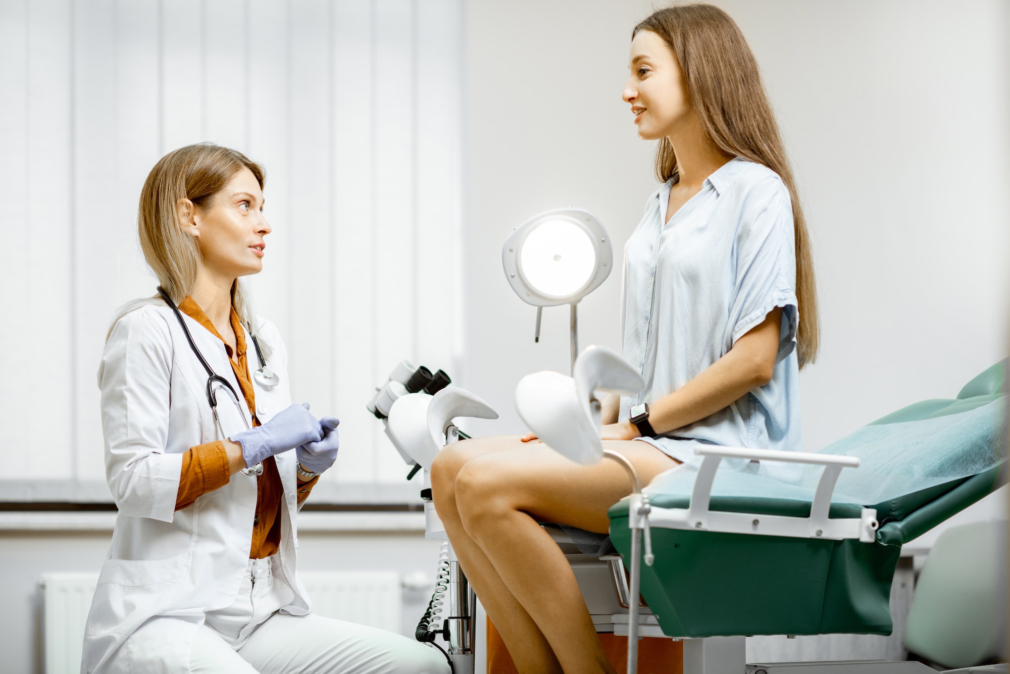 Gynecologist with patient in the office